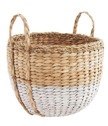 large seagrass basket with handles on a white background