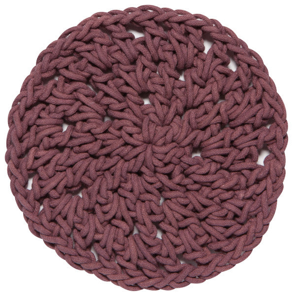 round ash plum knotted trivet on a white background