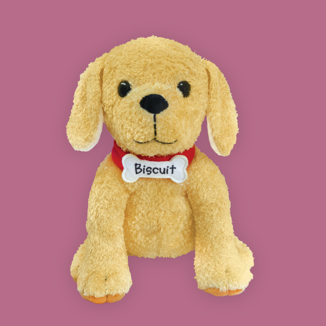 biscuit the little yello puppy plush toy on a pink background