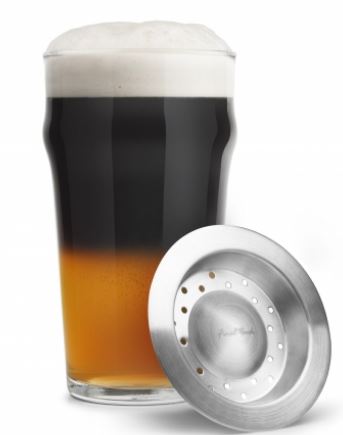 black and tan glass filled sitting beside the layering tool on a white background