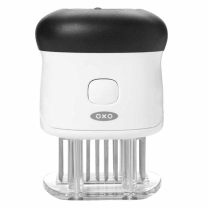 tenderizer with white and black handle, tenderizing blades, and protective plate.