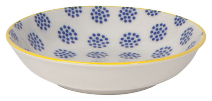 side view of dish with blue dots on the interior and yellow rim.
