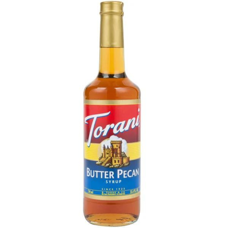 bottle of Torani Butter Pecan Syrup on white background.