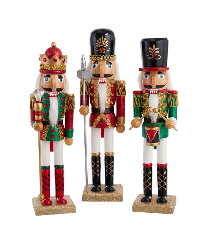 3 wooden nutcrackers dressed as soldiers and a king.