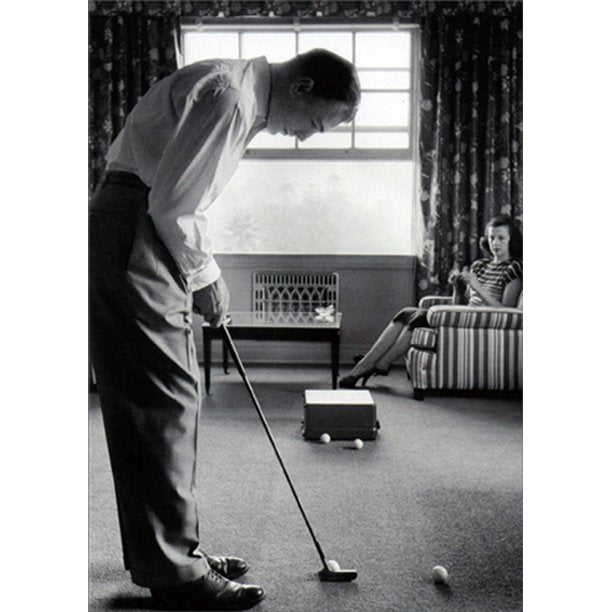 front of card is a photograph of a man putting golf balls in a living room with a woman