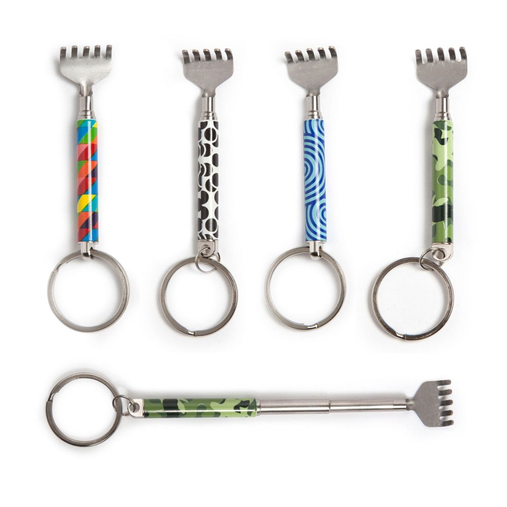 display of four patterned mini backscratchers and one extended on a white background