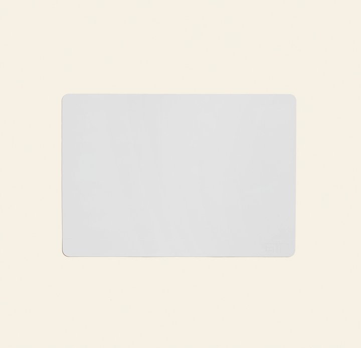 white baking mat on a cream colored background.