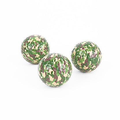 three camo golf balls on a white background