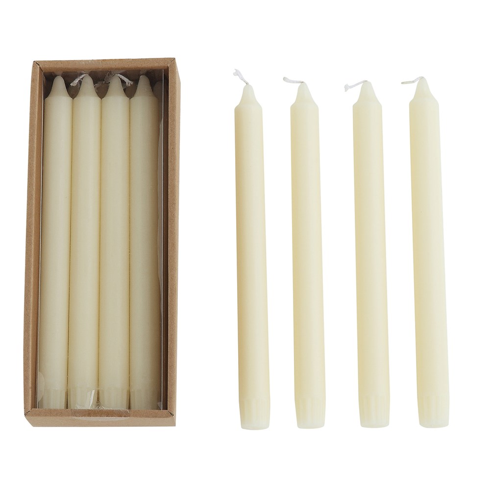box of four ivory tall tapers next to four open ivory tall tapers on a white background