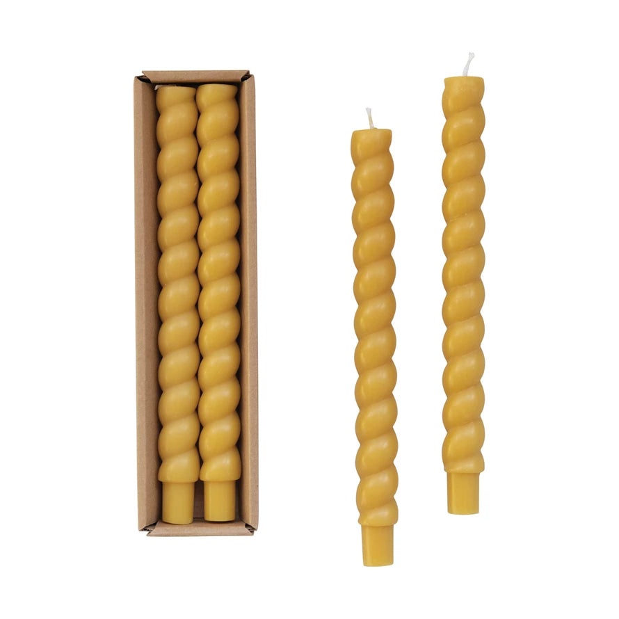 gold twisted taper candle set displayed in the box and two out of the box on a white background