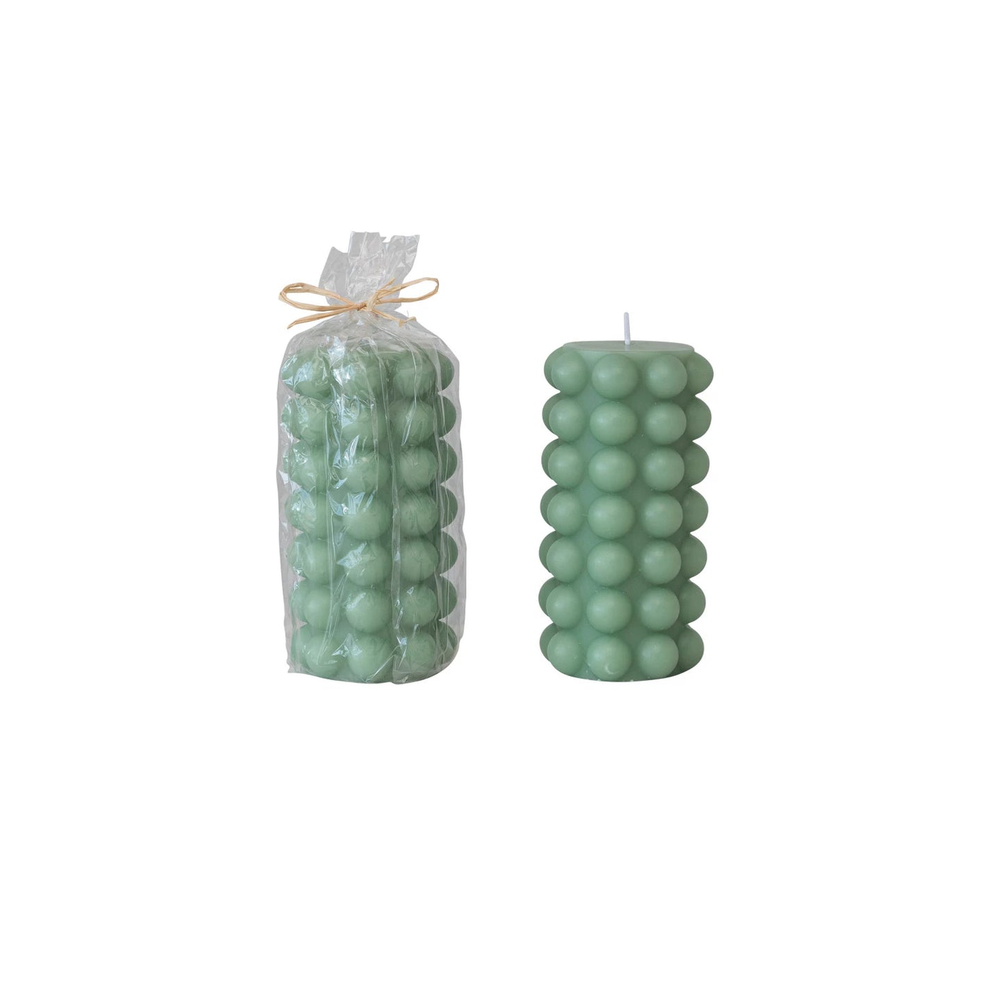 one tall teal hobnail pillar candle in clear wrap tied with twine and one with out packaging on a white background