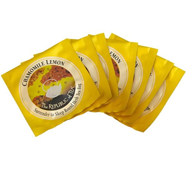 individual chamomile lemon herbal tea bag packets spread across a white background