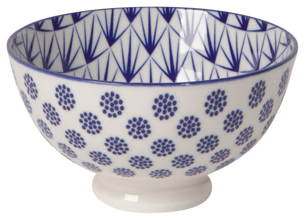 white ceramic bowl with blue patterns inside and out.