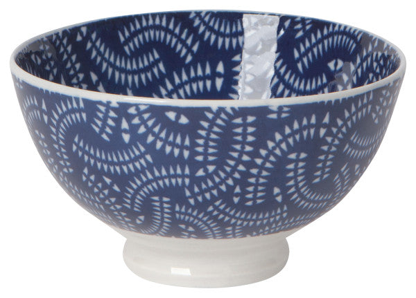 white ceramic bowl with blue geometric pattern inside and out.