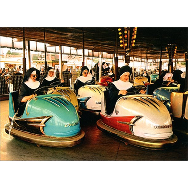 front of card is a photograph of nuns riding in bumper cars 