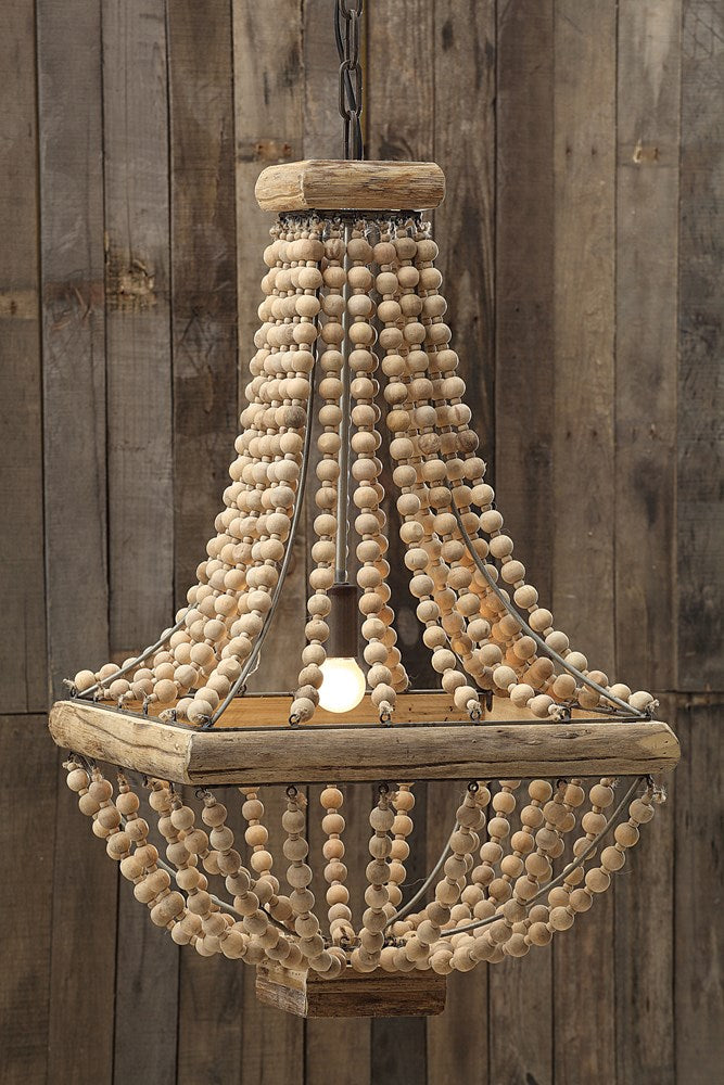 metal chandelier with wood beads hanging against reclaimed wood wall