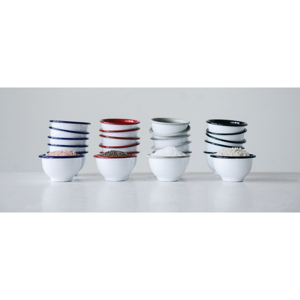 four stackes of different colored enameled tin pinch bowls against a light gray background