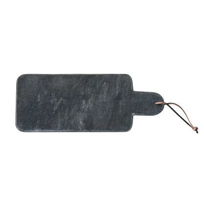 black marble cheese board with leather strap on a white background