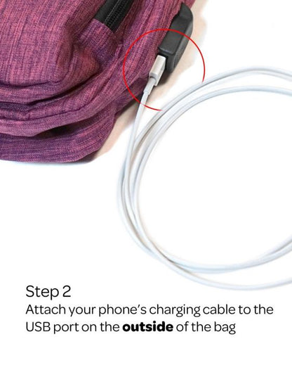 plum anti-theft daypack illustrating the usb port on the outside of the bag on a white background