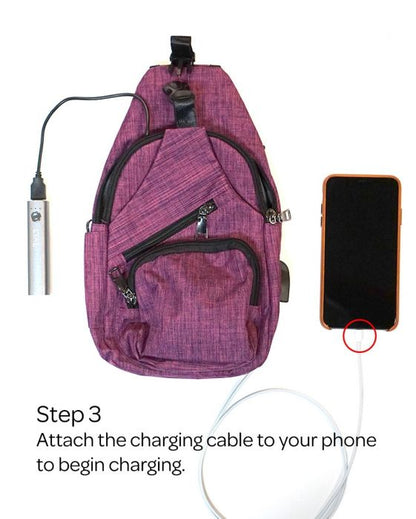 anti-theft daypack illustrating to attach a cell phone to the charging cable that is plugged into the daypack on a white background.