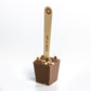 the milk chocolate dunking spoon on a white background
