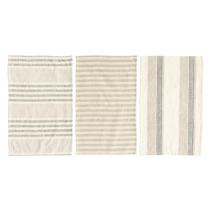 all three styles of woven cotton striped tea towels laid out on a white surface