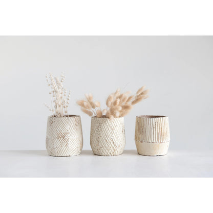 3 wooden pots with creamy finish on a row, 2 have dried botanicals in them.