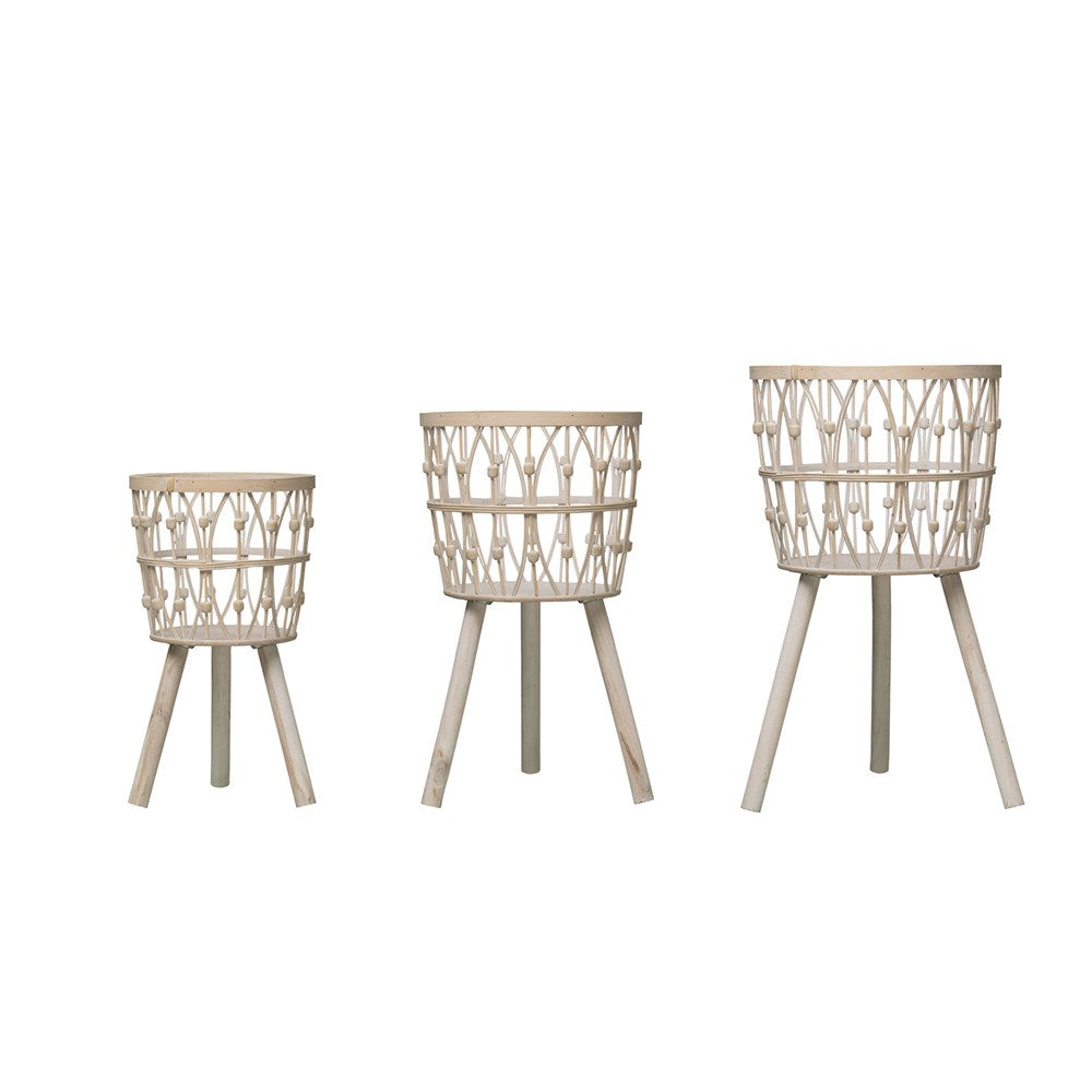 all three sizes of the bamboo and wood baskets with legs on a white background