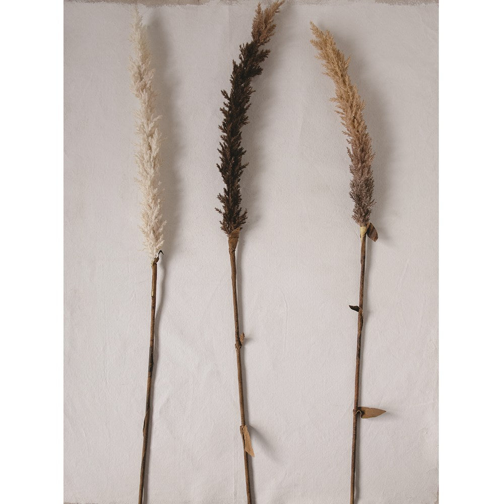 three faux flocked grass plumes on a white background
