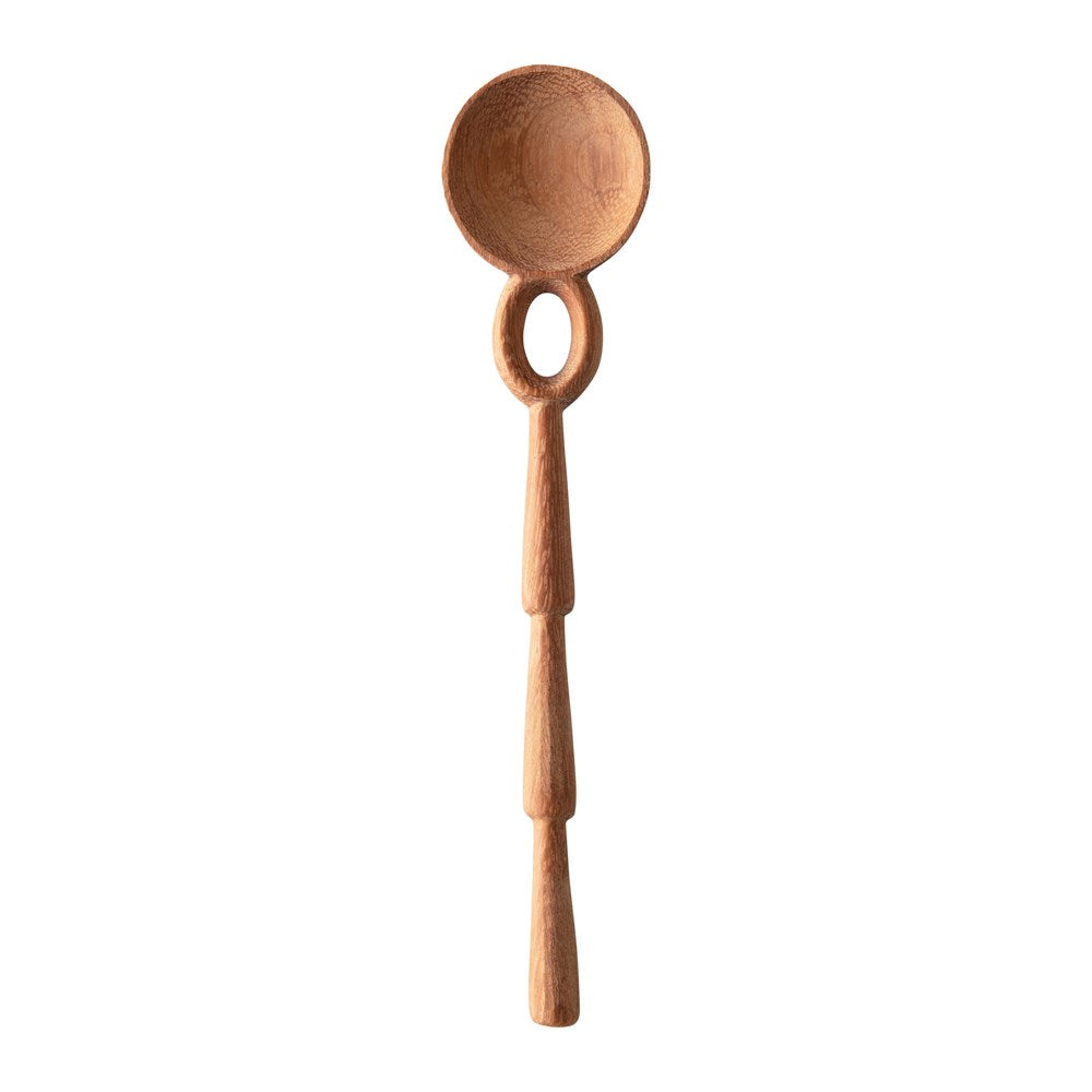 hand carved doussie wood spoon on a white background