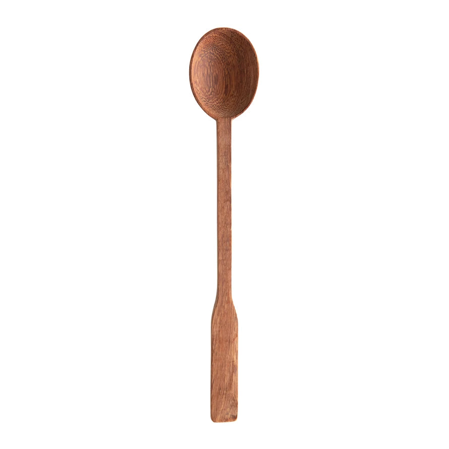 narrow hand carved doussie wood spoon on a white background