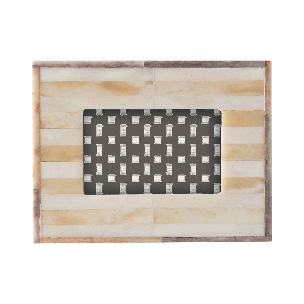 A two-tone photo frame with a light grey border and beige stirpes
