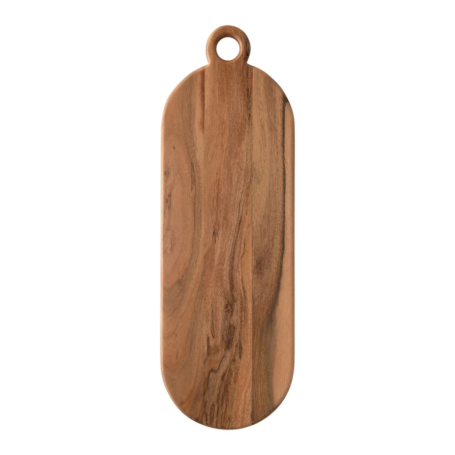 oval acacia wood cutting board with handle on a white background
