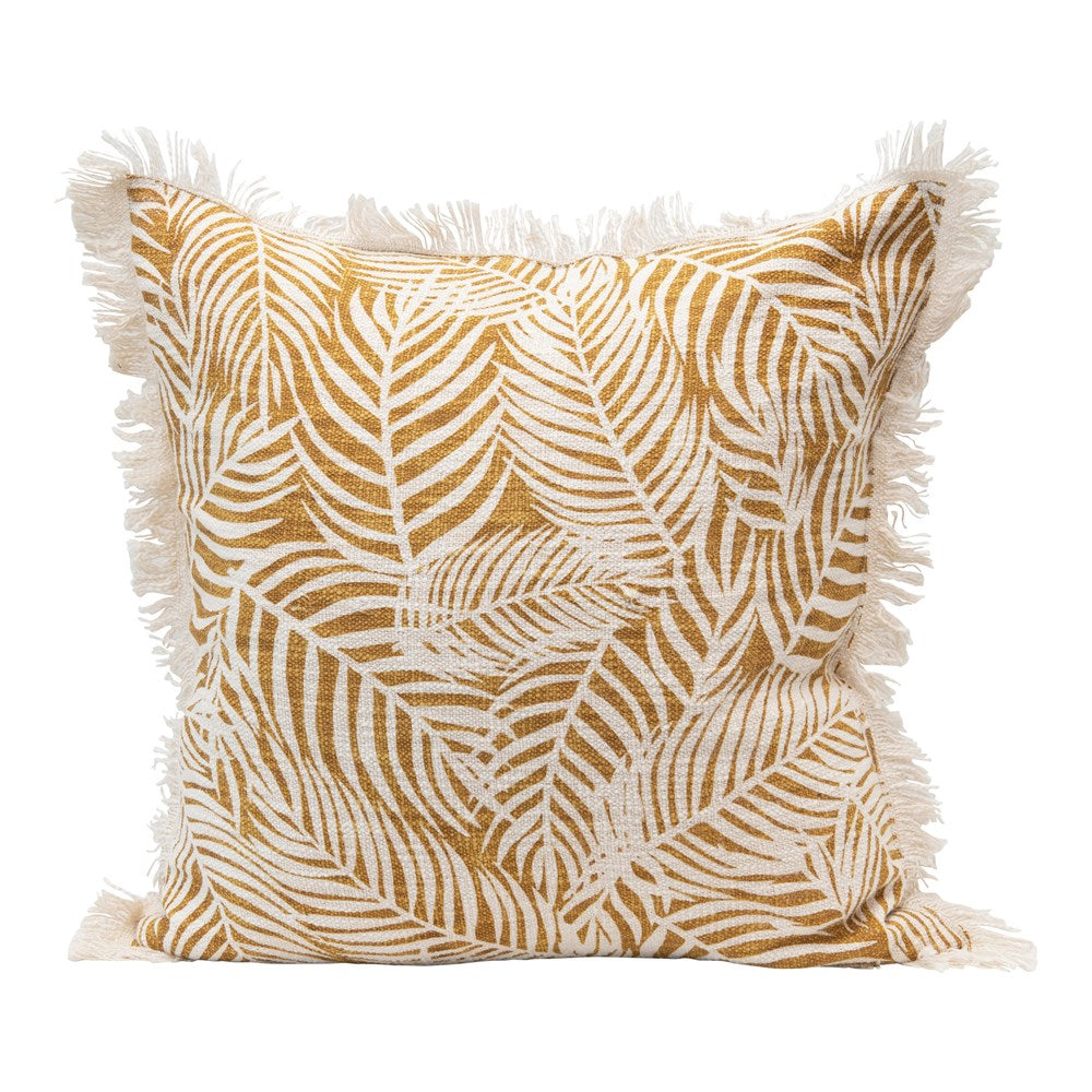 mustard palm frond pillow on with eyelash fringe on a white background