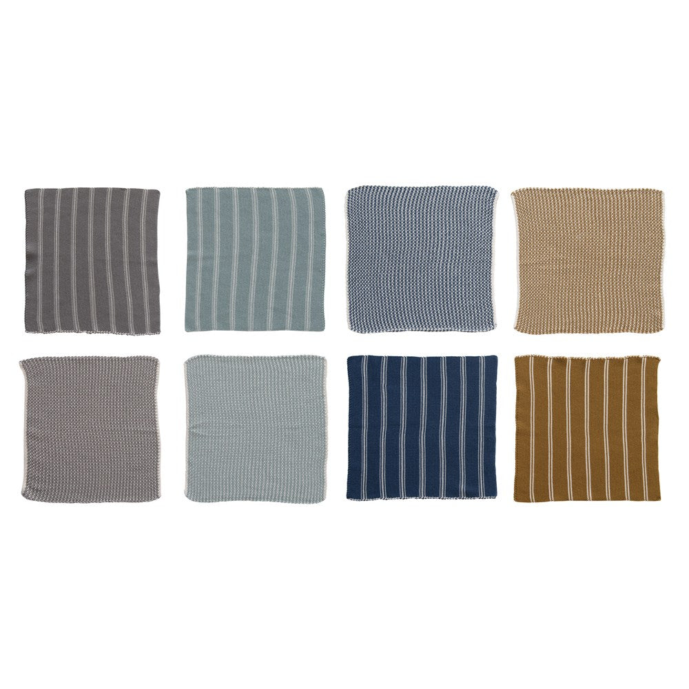 eight different colored cotton dish cloths in two rows on a white background