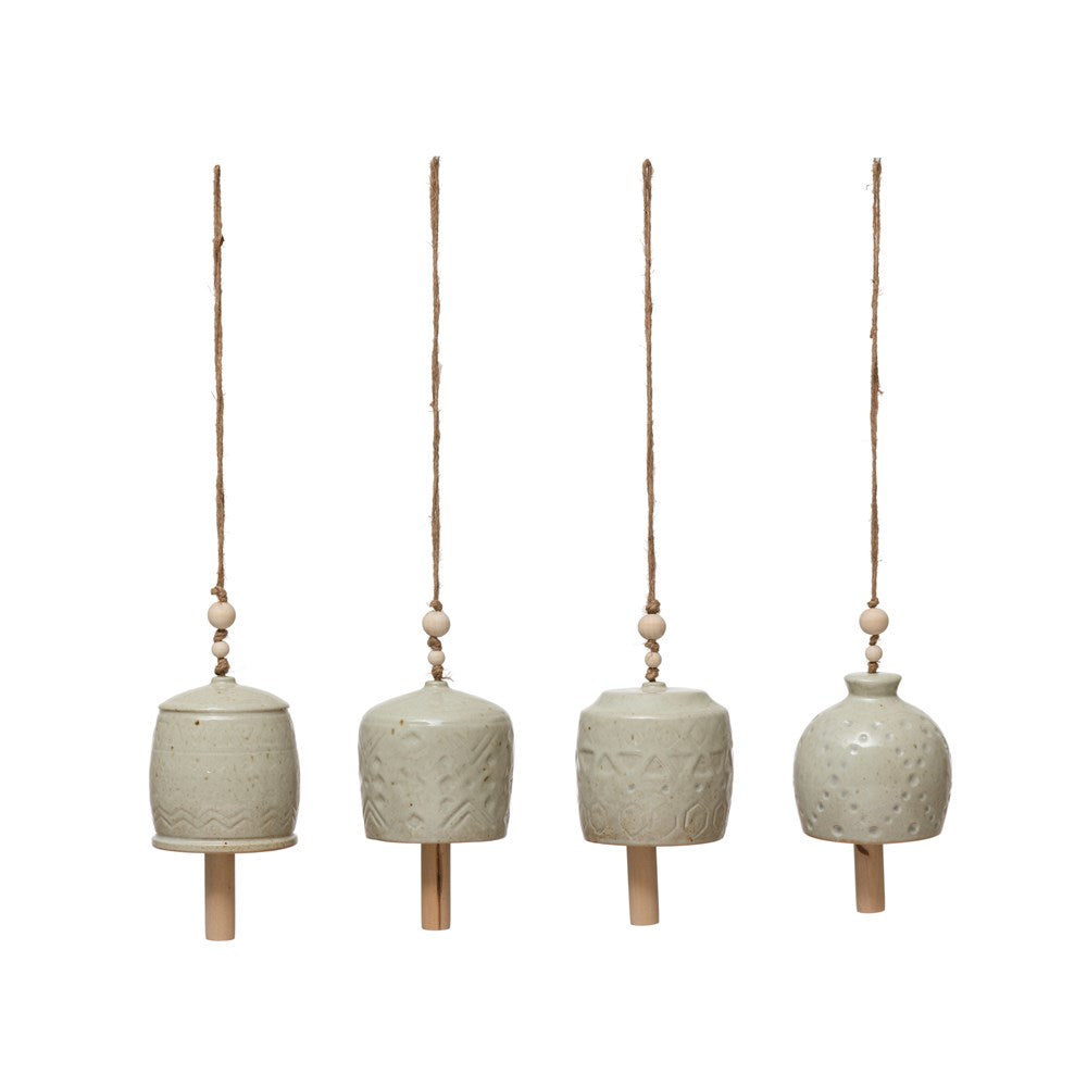 all four styles of patterned stoneware wind chimes hanging against a white background
