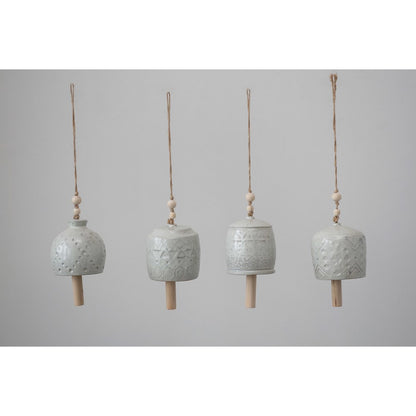 all four styles of patterned stoneware wind chimes hanging against a light gray background