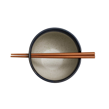 top view of the stoneware noodle bowl with chopsticks on a white background