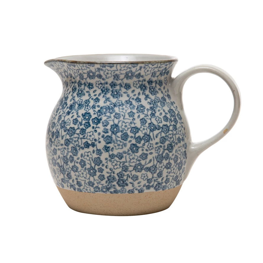 blue floral print stoneware pitcher displayed against a white background