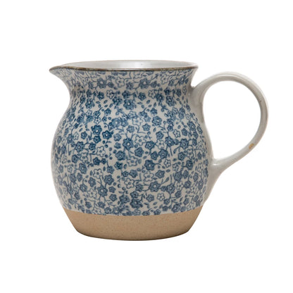 blue floral print stoneware pitcher displayed against a white background