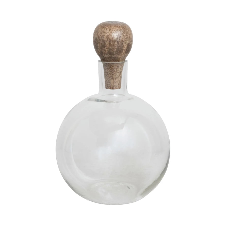 glass decanter with mango wood stopper on a white background