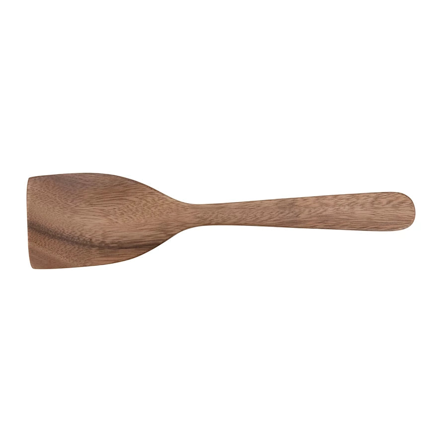carved acacia wood spatula on a white background