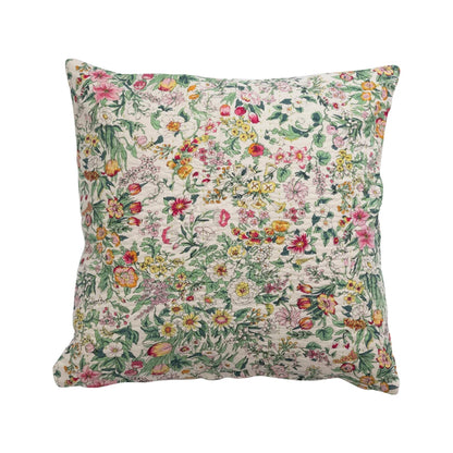 off-white pillow covered in a dainty floral print.