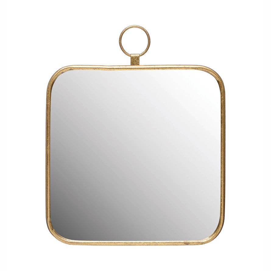gold metal framed mirror on a white background