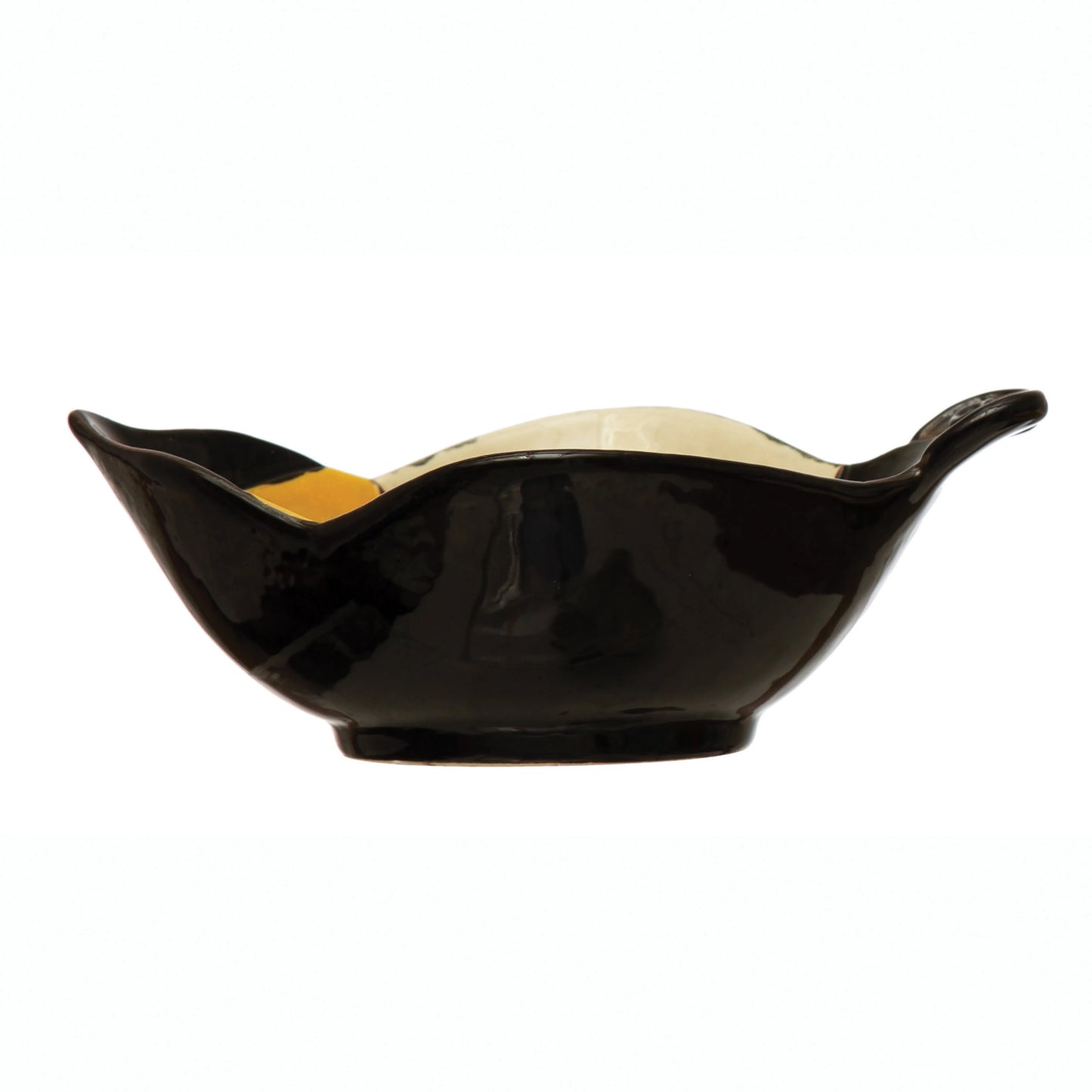 side view of the hand painted stoneware bee bowl on a white background