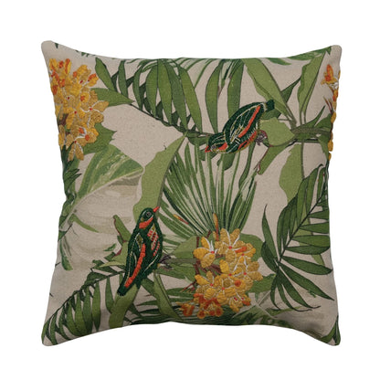off-white pillow with palm leaves, yellow flowers, and green and orange birds.