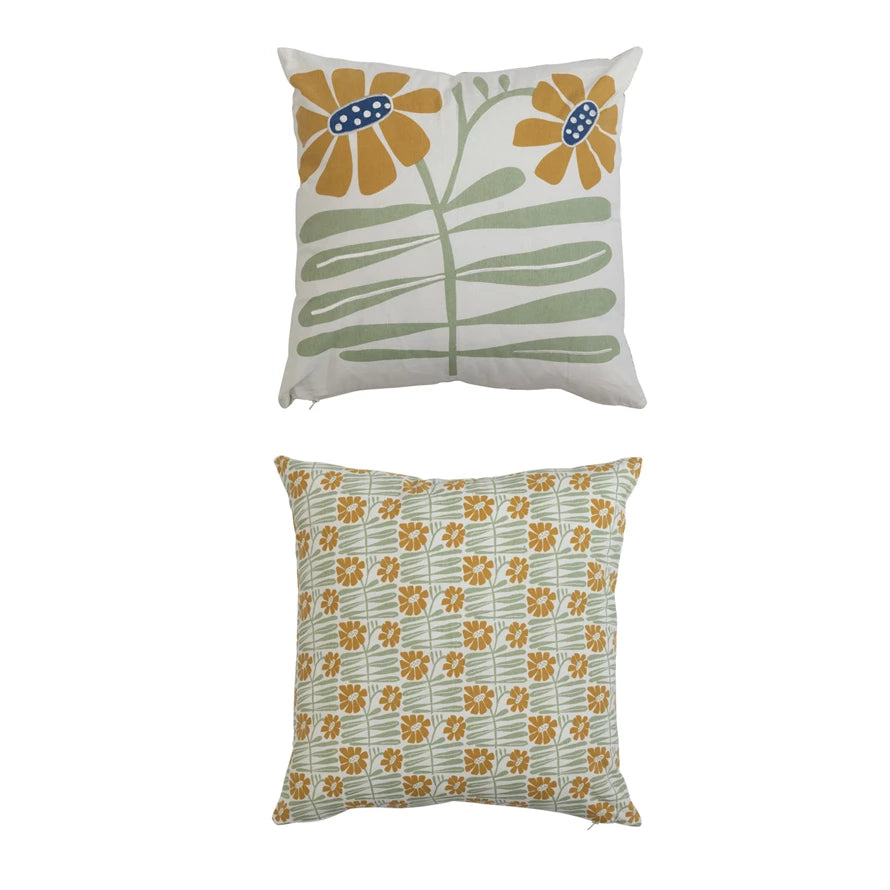 front and back view of pillow, back has an all-over print of small yellow flowers on green stems.