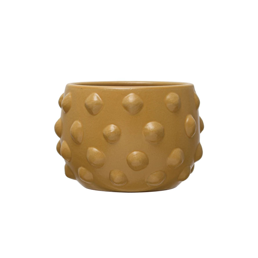 small mustard yellow planter with all-over raised dots.
