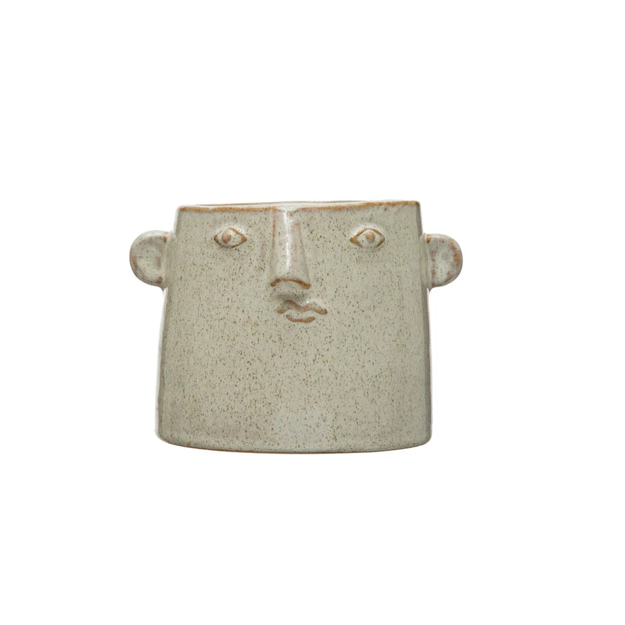 face planter with speckled glaze on a white background.