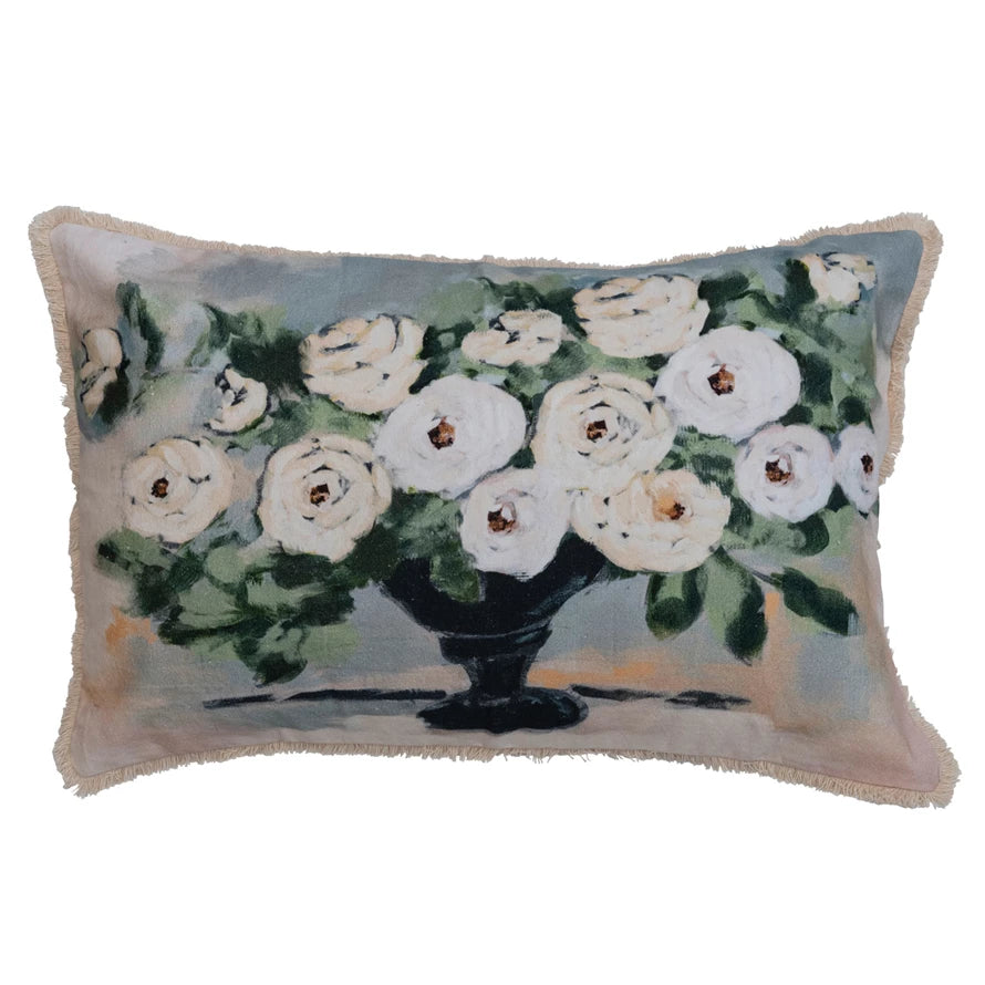 flower and eyelash fringe lumbar pillow displayed against a white background